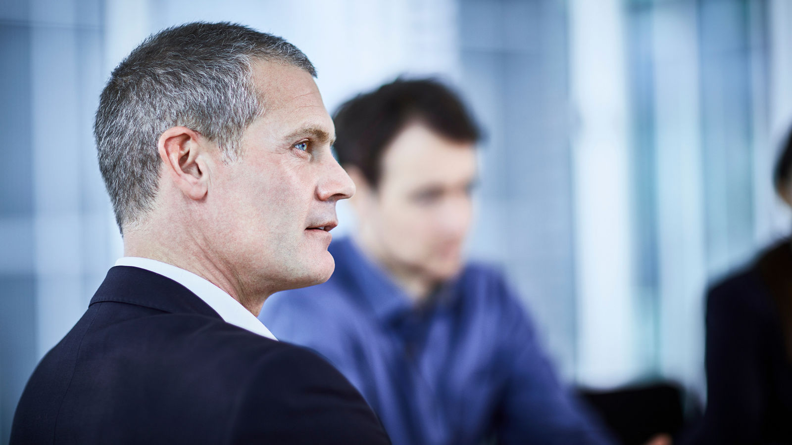 Attentive businessman listening in meeting