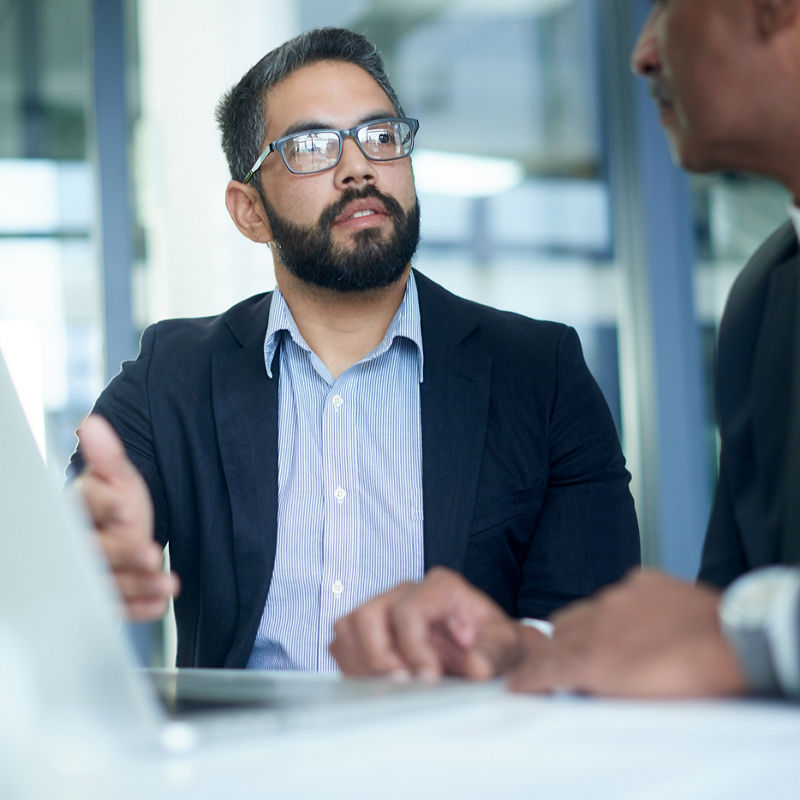 Shot of two businessmen having a discussion in an office