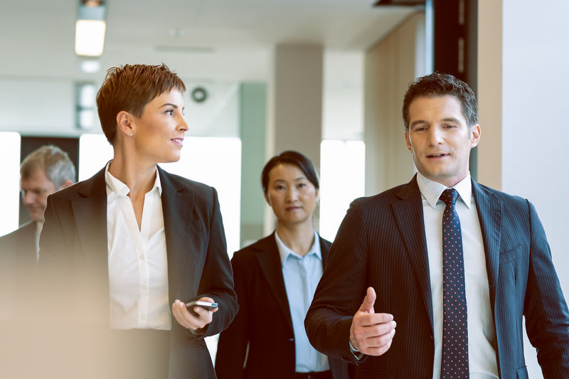 Federal workers consulting in a lobby