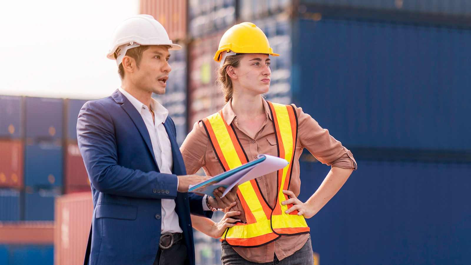 Procurement officer speaking to shipyard employee