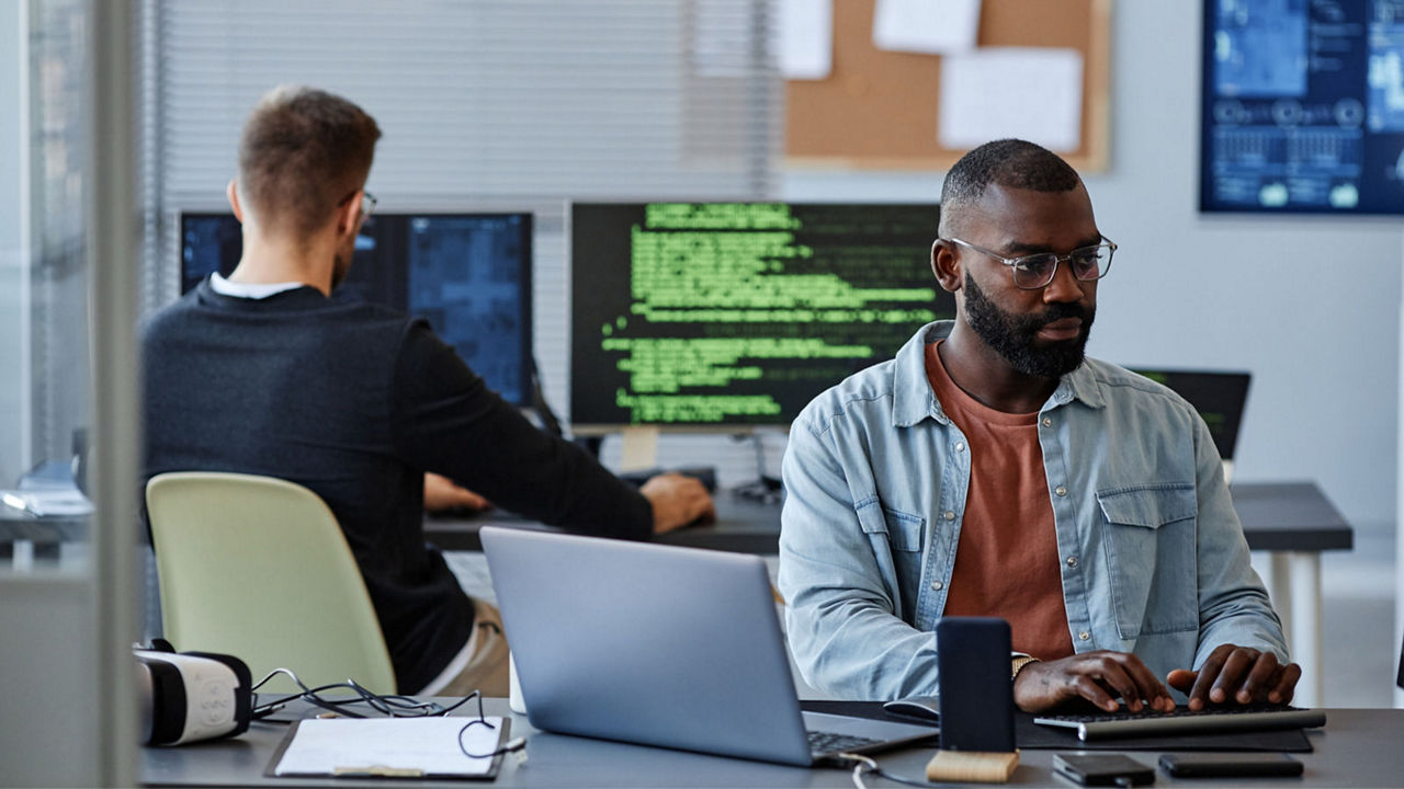 Man using computer in software office