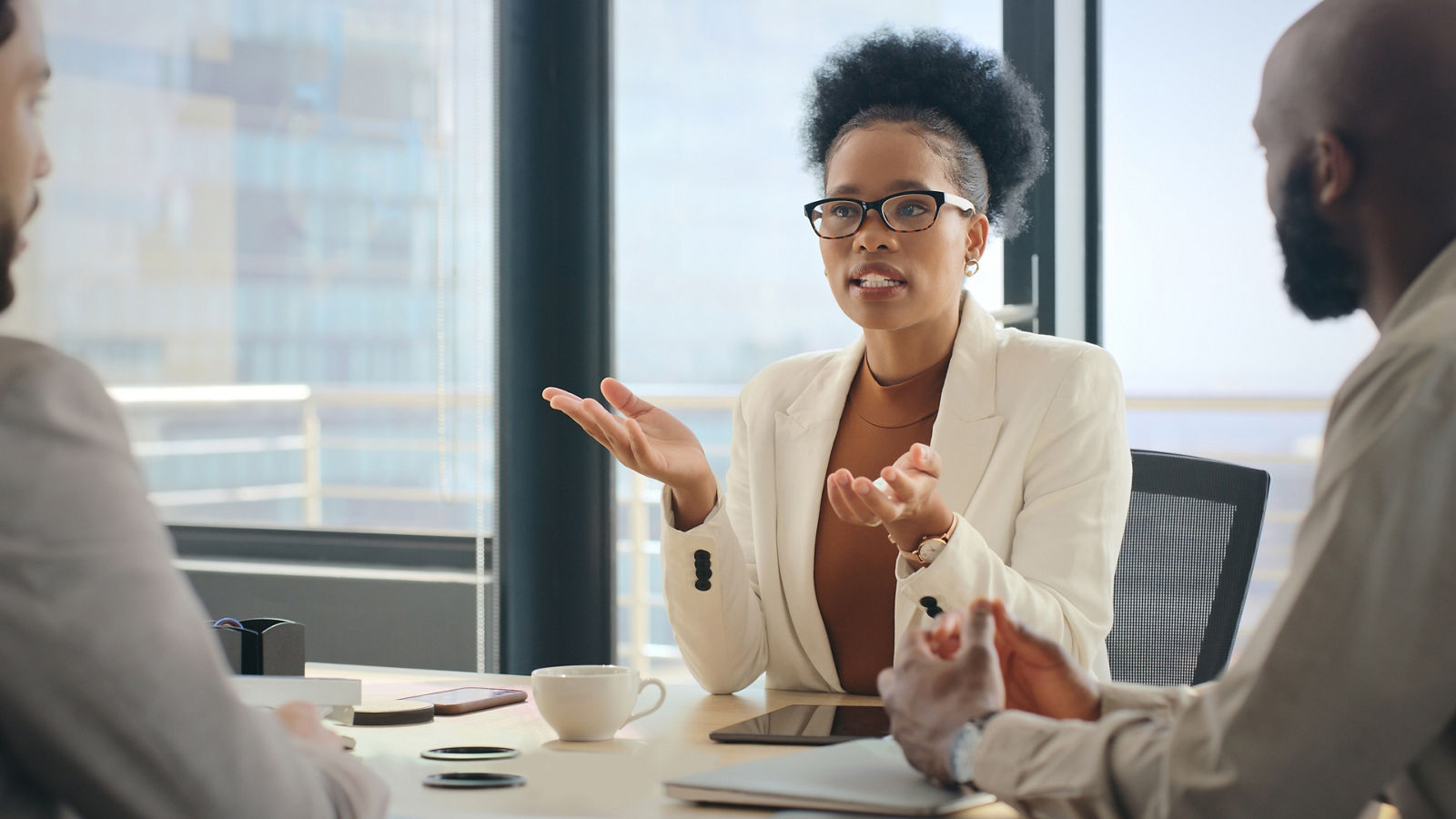 Lawyer talking with coworkers at desk
