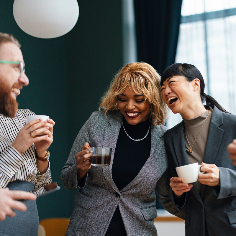 Diverse group of professionals socializing