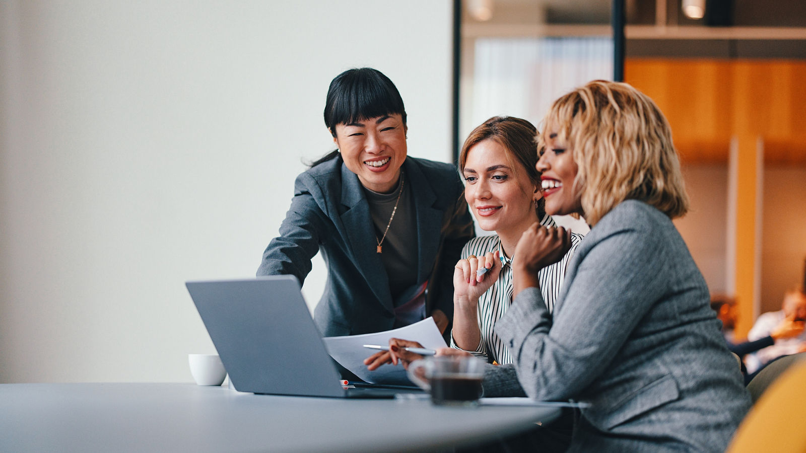 Three smiling business workers