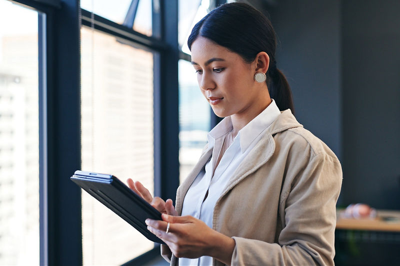Business woman looking at tablet