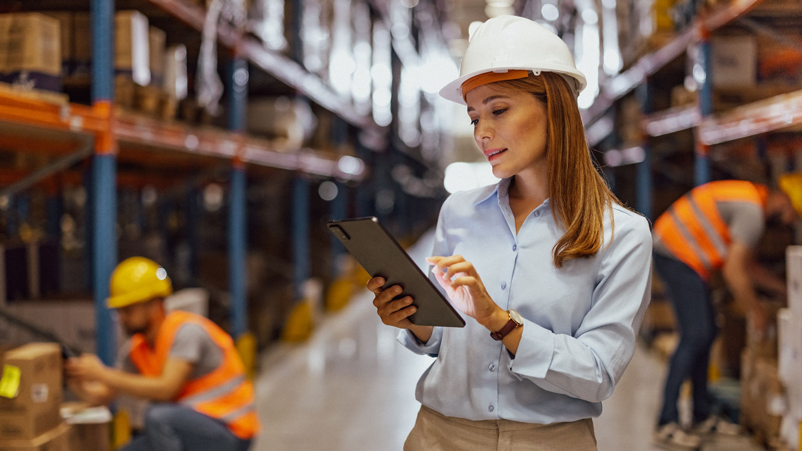 Portrait of female manager of a distribution warehouse, Woman supervising the operation of a distribution warehouse