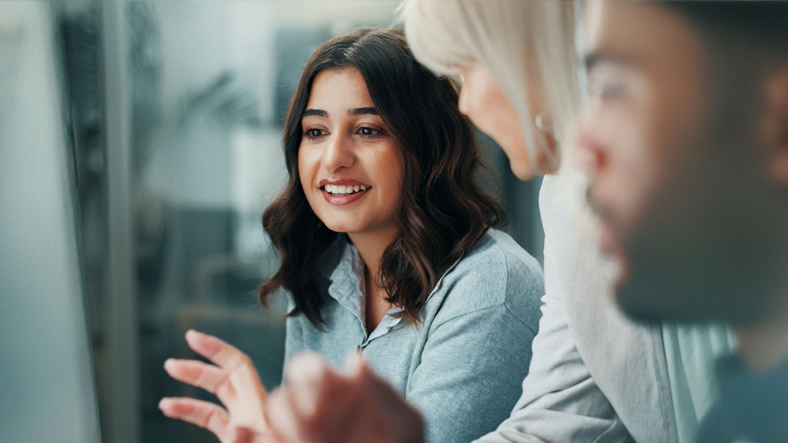 Teamwork, computer and mentor with business people in office for research, planning and journalist advisor. Coaching, help and collaboration with employees in agency for discussion and article editor.