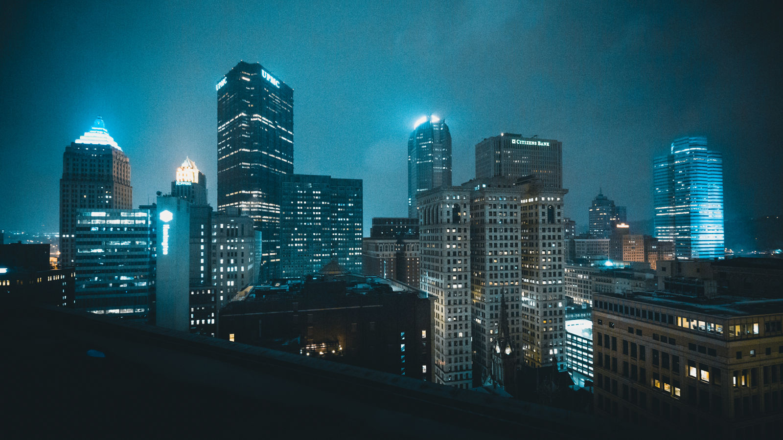 LOW ANGLE VIEW OF ILLUMINATED CITYSCAPE