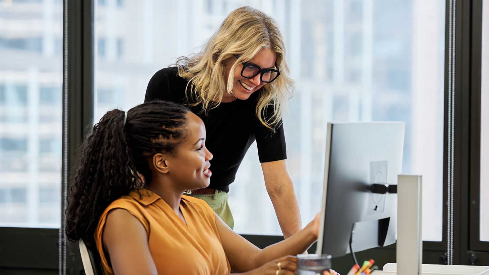 Two people working together in an office