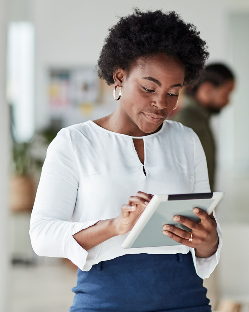 Woman using tablet at office