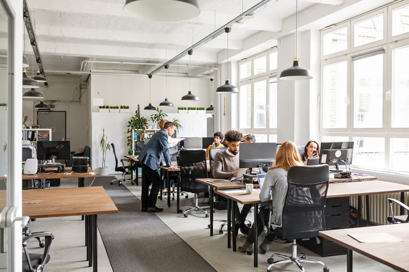 Business professionals working in modern office space.