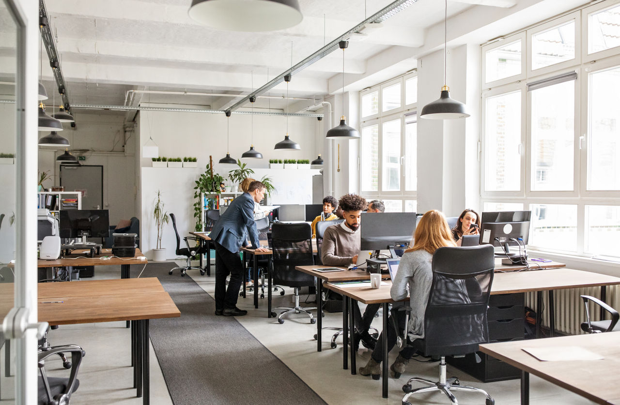 Business professionals working in modern office space.