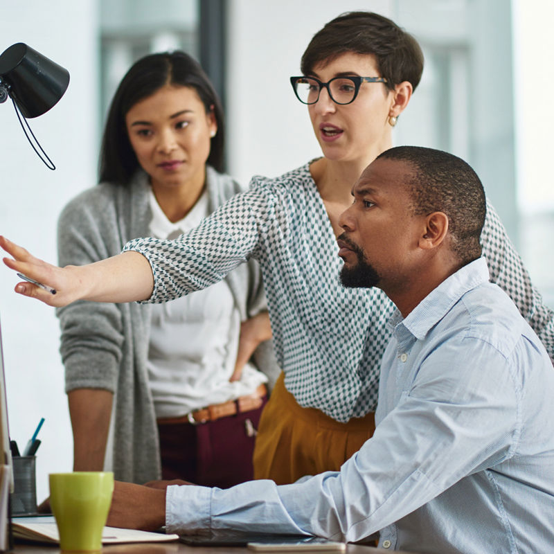 Cropped shot of a group of colleagues working in their office