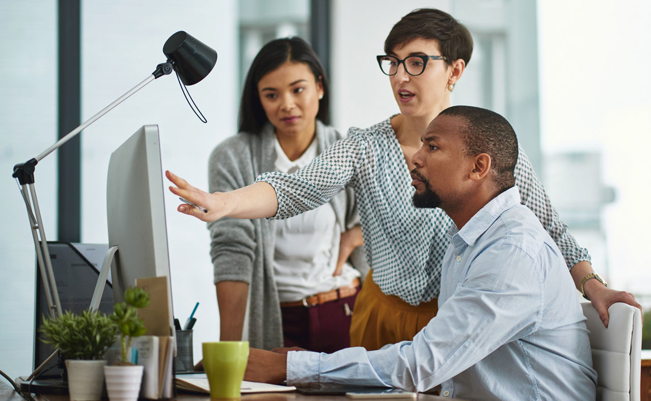 Cropped shot of a group of colleagues working in their office