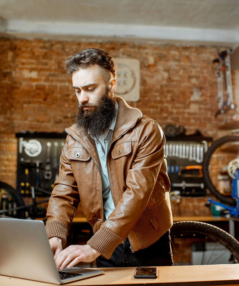 Bicycle Shop owner working on a laptop
