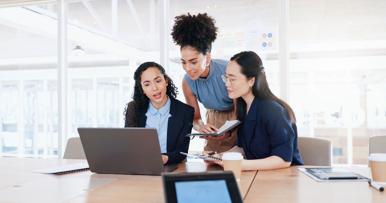 Business women, laptop and collaboration in office 