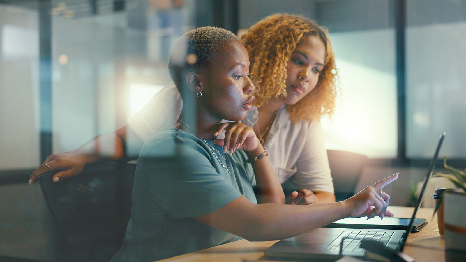 Office glass window, laptop and team communication on social network feedback, customer experience or ecommerce. Brand monitoring data, collaboration teamwork and black women review online survey.