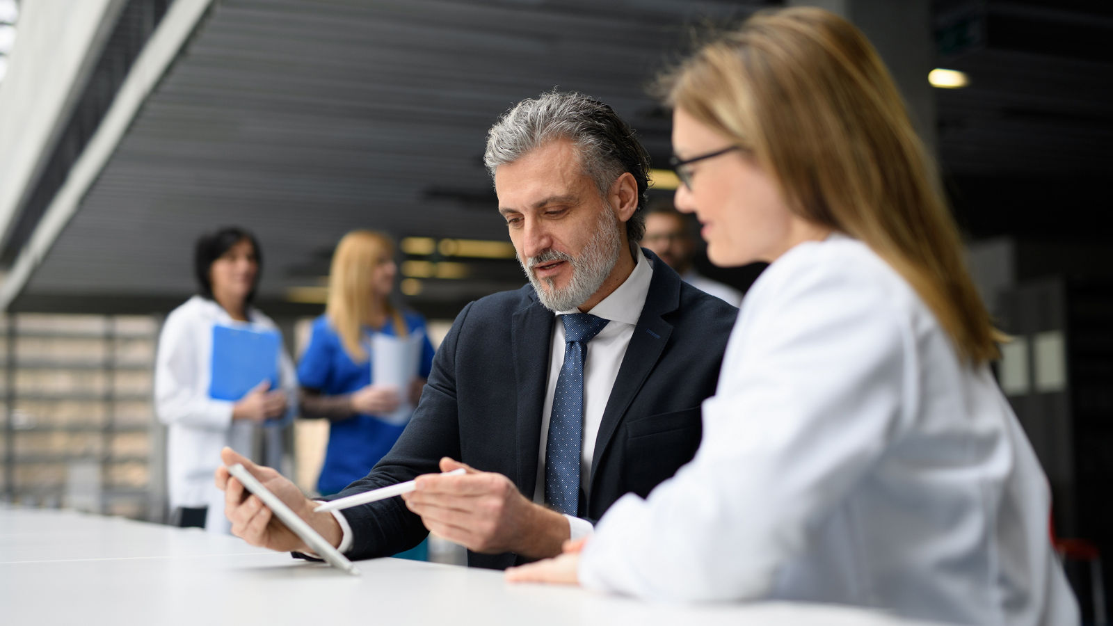 Woman doctor talking to representative provider
