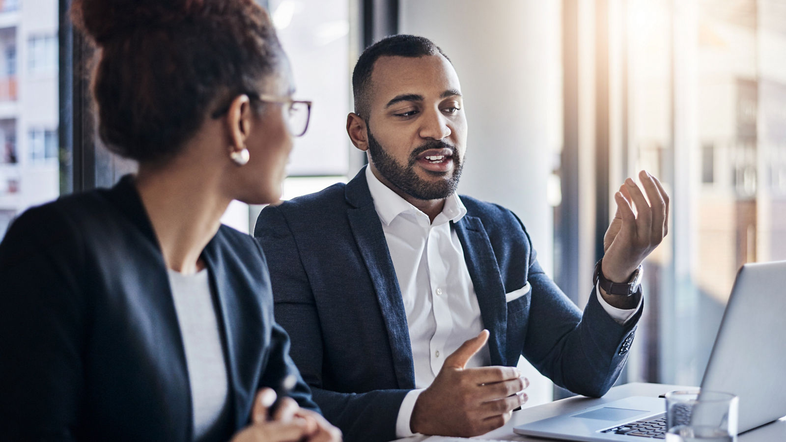 Shot of two businesspeople having a discussion in an office