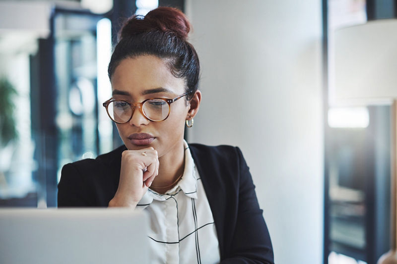 Businesswoman using a laptop in a modern office