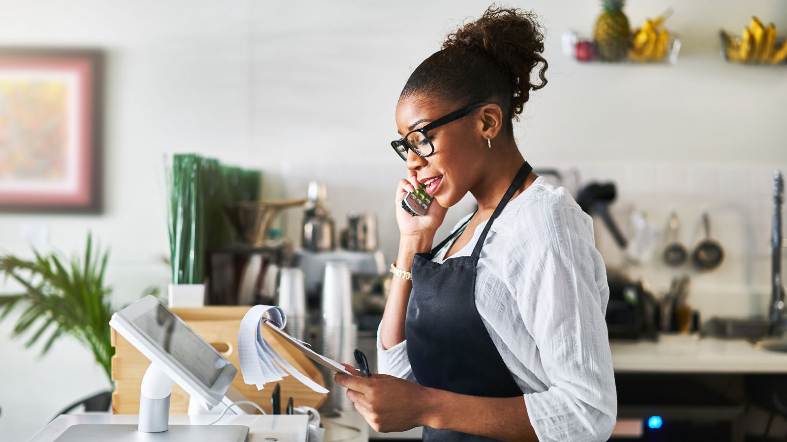 Small Business Owner talking on phone at restaurant