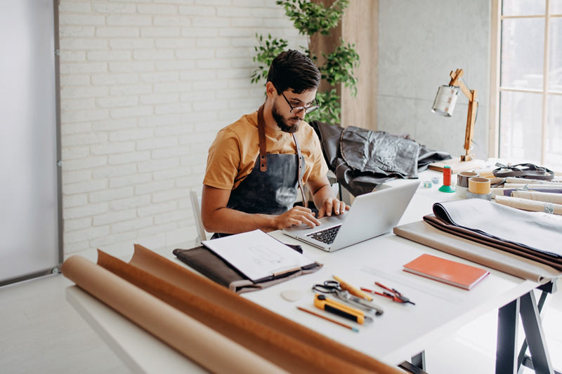 Small business owner on computer.