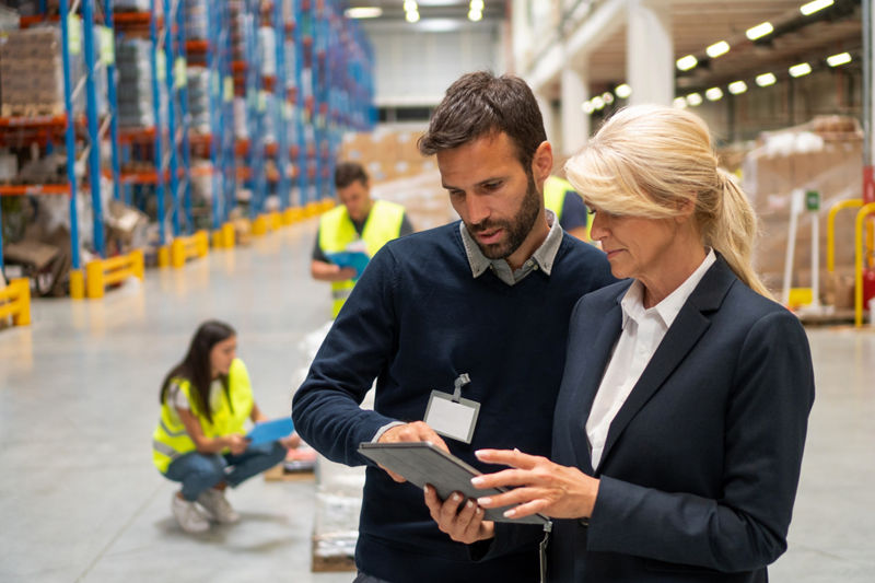 Managers in Warehouse discuss about business strategy
