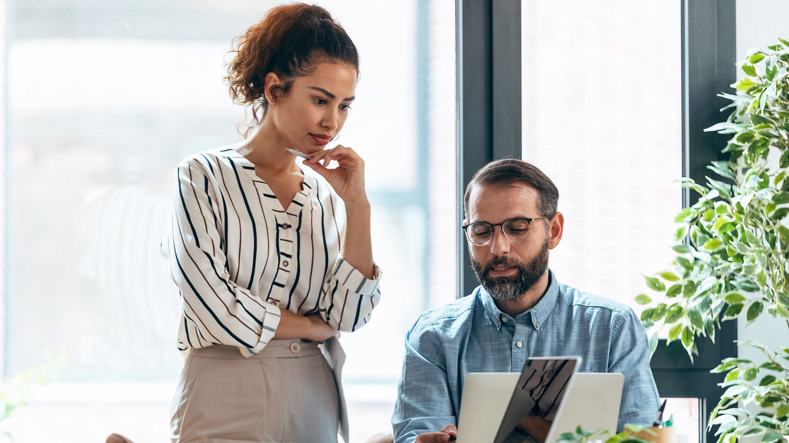 Business people working together with laptop