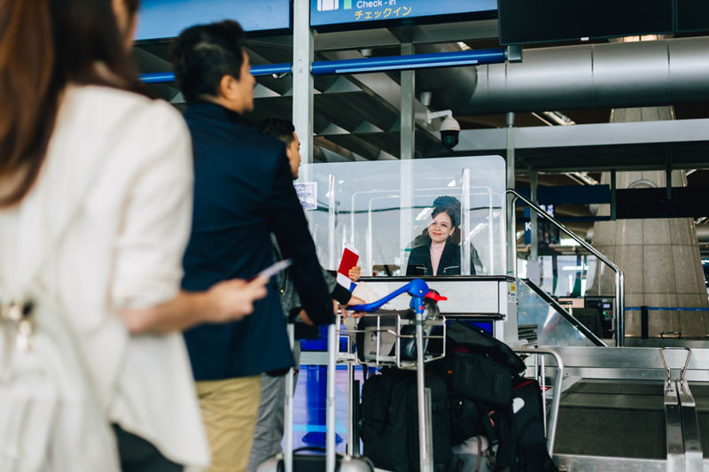 Travelers moving through airport