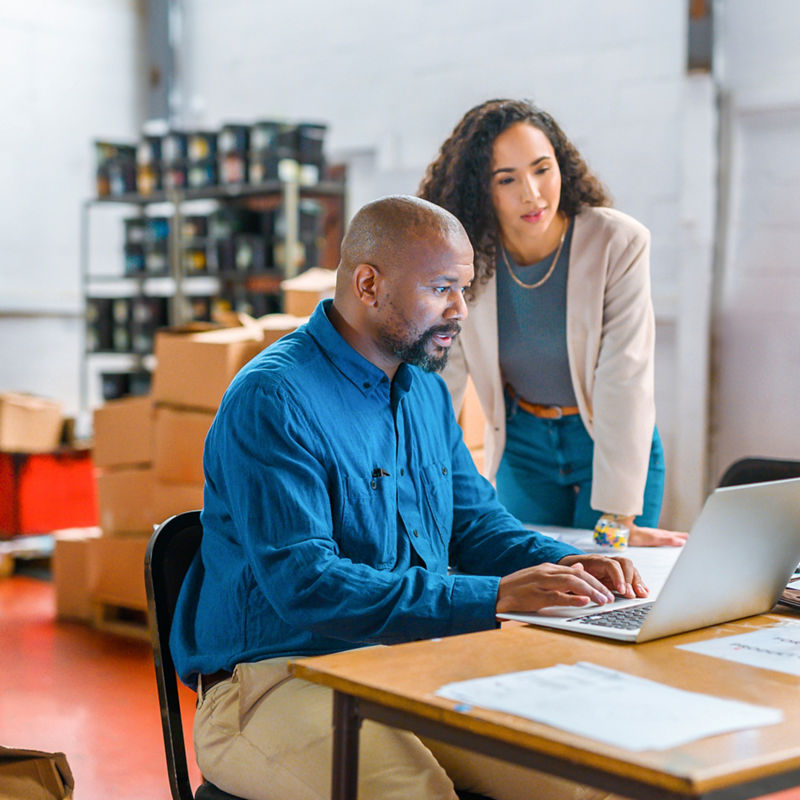 Logistics, ecommerce and business people working on laptop delivery, shipping or online shopping orders. Cargo, supply chain and checklist with employees in storage, package factory warehouse