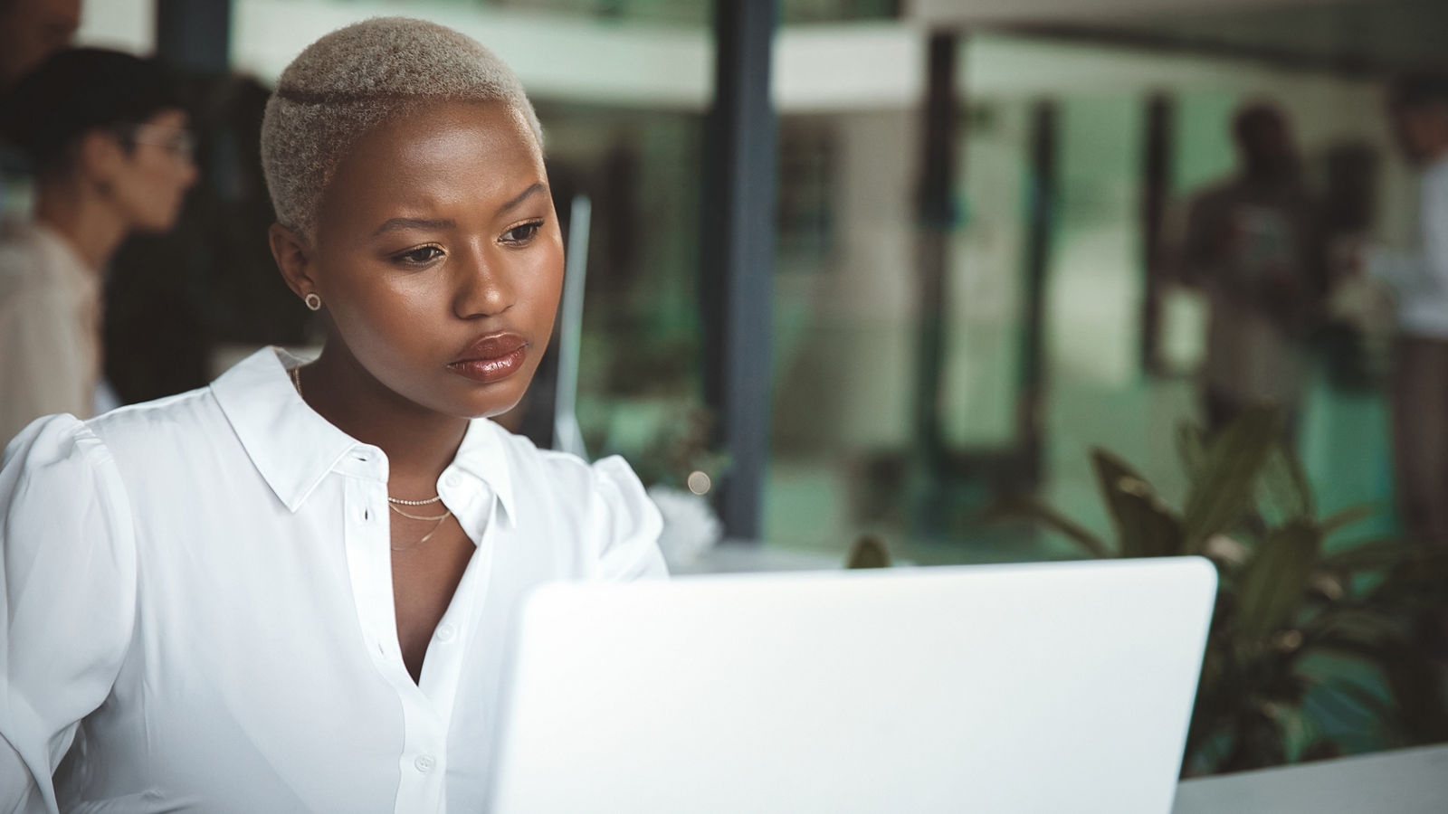 Business woman working at her computer at the office