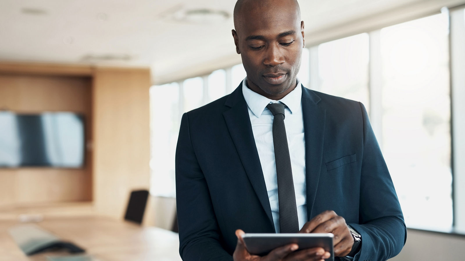 Working man with tablet in office setting
