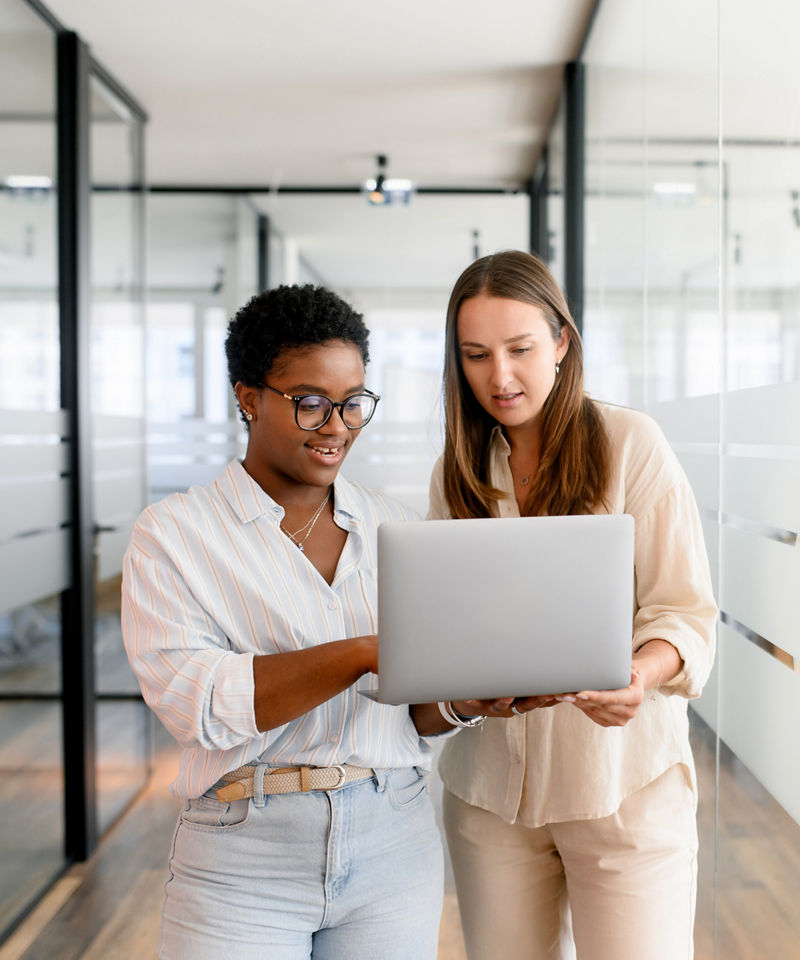 Two coworkers chatting during coffee break