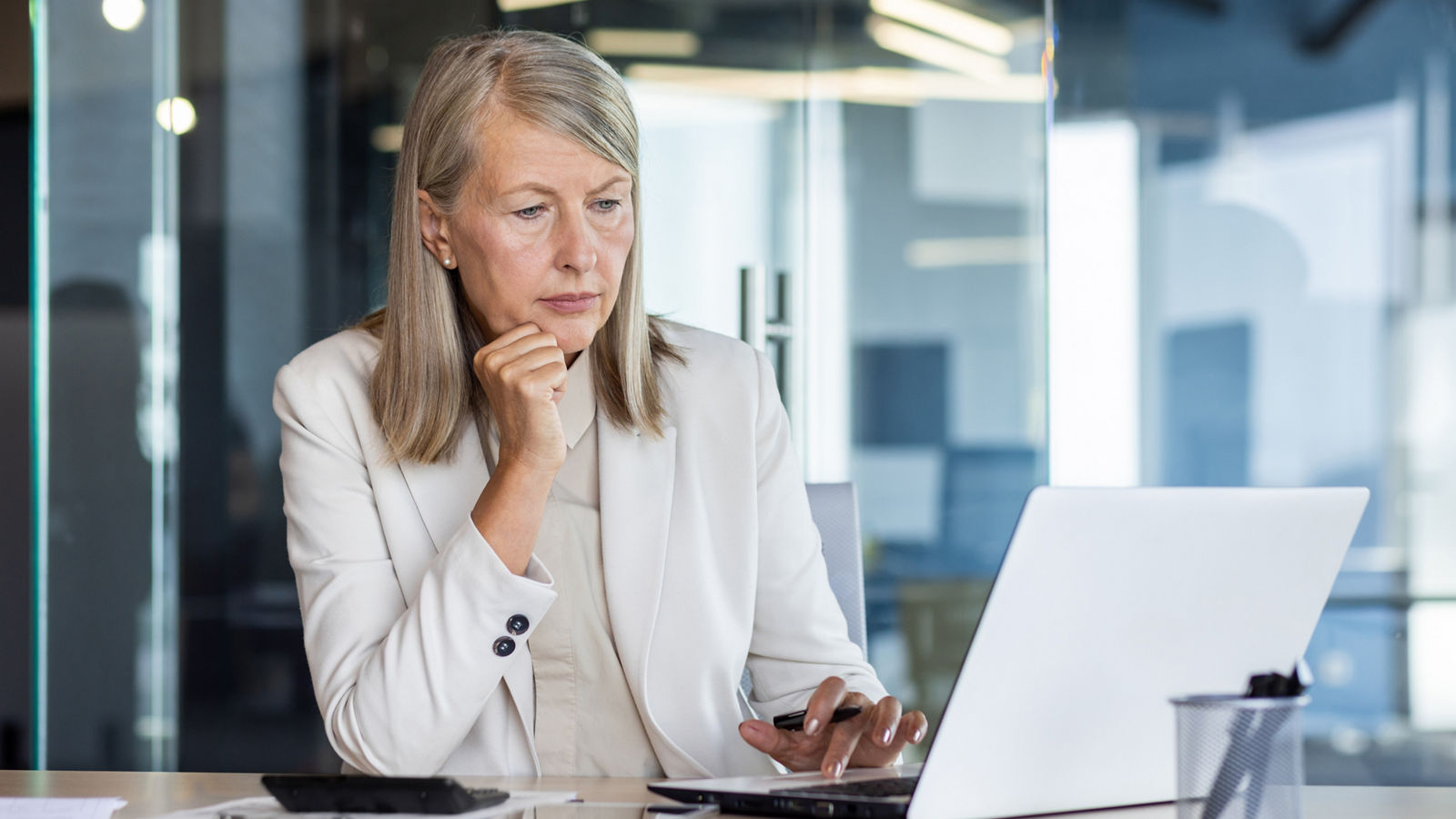 Focused woman working on laptop