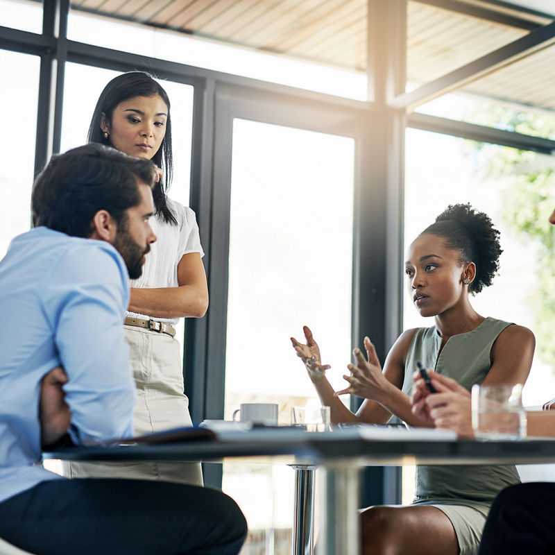 Shot of a group of colleagues working together in an office