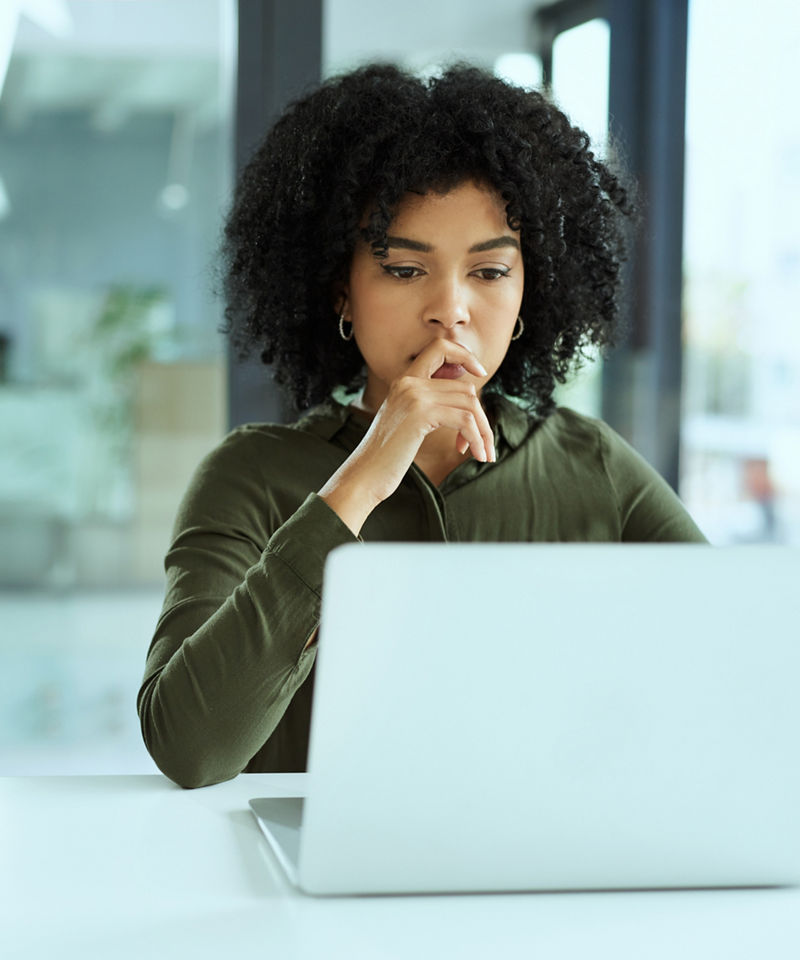 Businesswoman using a laptop in a modern office
