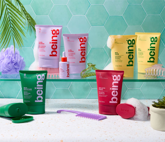 Bathroom shelves featuring being haircare products and decorated with hair combs, hair clips, and other affordable bathroom accessories from pOpshelf.