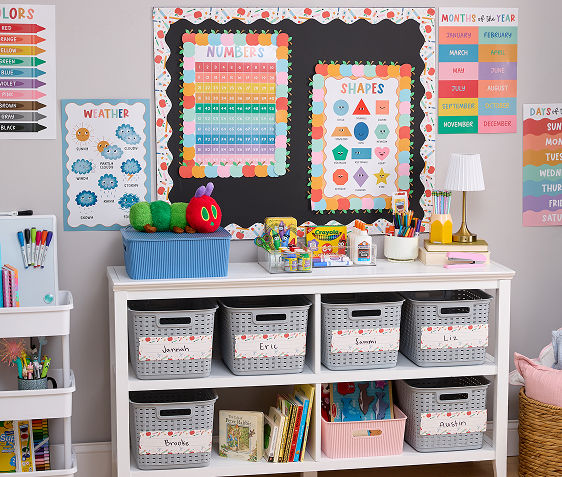 A classroom is decorated for the new year with colorful bulletin borders, posters organizational bins, name cards, and supply essentials in your favorite brands.