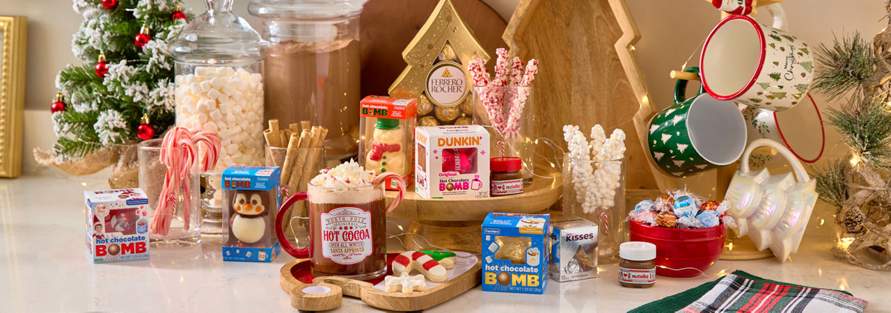 Hot cocoa bar with cocoa bombs, candy stirrers, Christmas mugs, apothecary jars, serving boards & more.