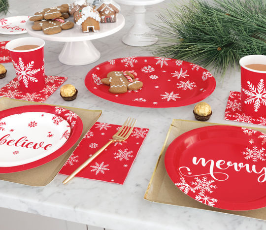 Christmas tablescape with snowflake plates, napkins, cutlery, cups