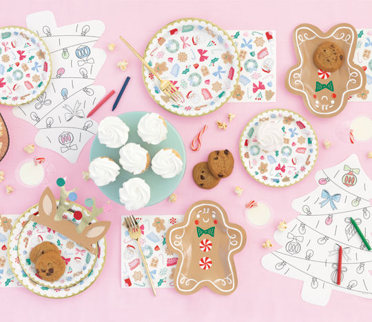 Christmas tablescape with gingerbread plates, napkins, cutlery