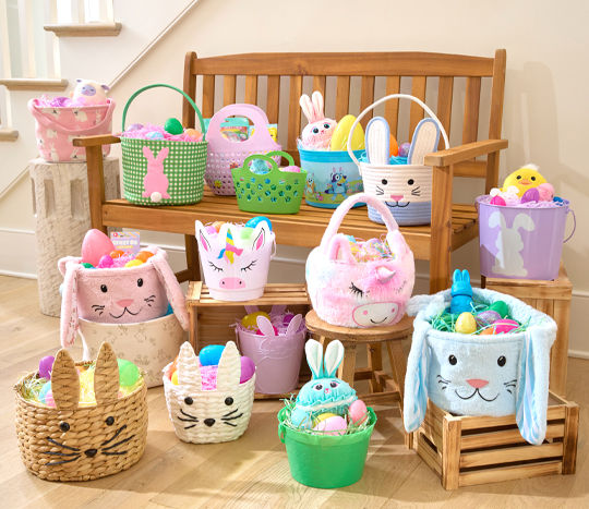 Various Easter basket styles from pOpshelf filled with Easter grass, and plastic fillable Easter eggs., chocolate bunnies, candy & other baskets stuffers.