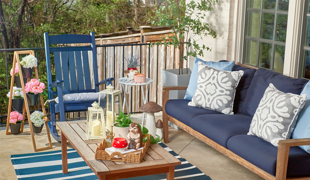 Patio decorated with new lawn & garden decor, pillows, chair cushions, and planters from pOpshelf.