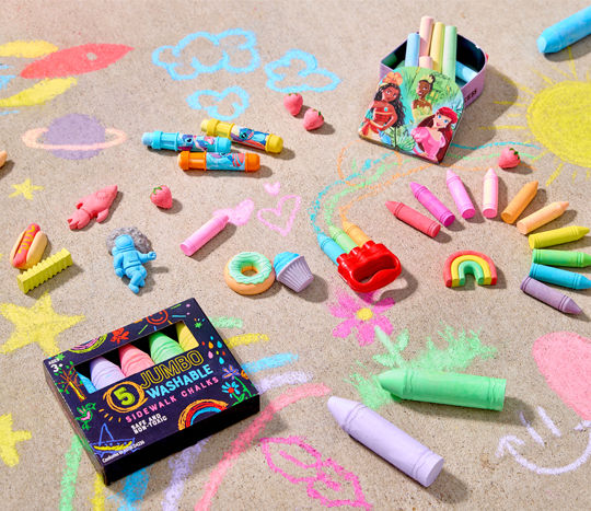 Sidewalk chalk in various designs, shapes, and colors displayed on top of sidewalk artwork.