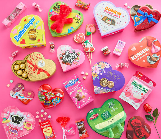Valentine's Day candy gifts: heart-shaped boxed candy, Ferrero Rocher, Dove chocolate, Sour Patch Kids, conversation hearts, cookie pops & more.