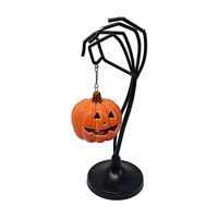 LED Hanging Pumpkin from Skull Hand Tabletop Décor