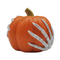 Decorative Skeleton Hand Holding A Pumpkin