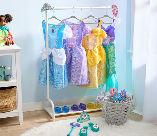 Preschool playroom with Disney Princess dress-up costume dresses, tiaras, shoes, and wands.