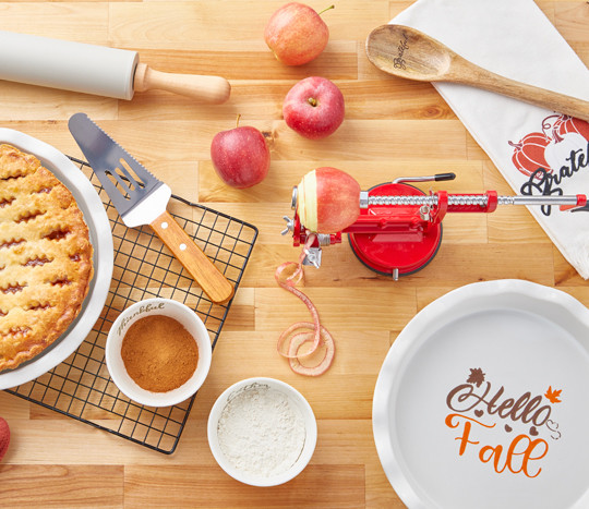 Apple peeler/corer/slicer, ceramic fall pie plate with server, fall kitchen towels, fall ramekins, rolling pin & more.