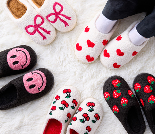 Cute novelty slippers from pOpshelf: smiley face, bows, hearts, cherries, and strawberries.